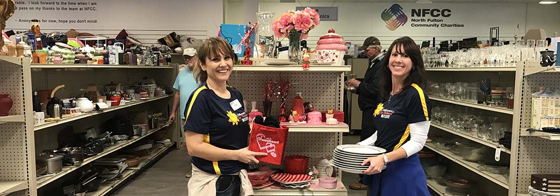 Two associates volunteer at the NFCC Thrift Shop.