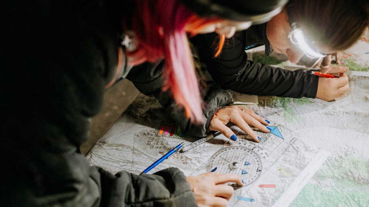 Drivers in the Rebel Rally using a map to navigate