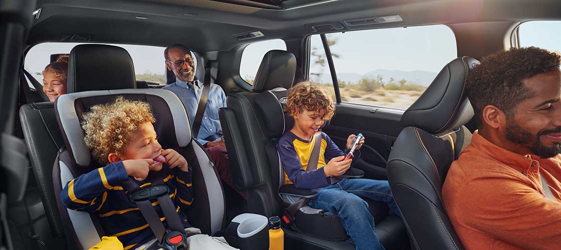 Family in a toyota on a road trip Hero Image