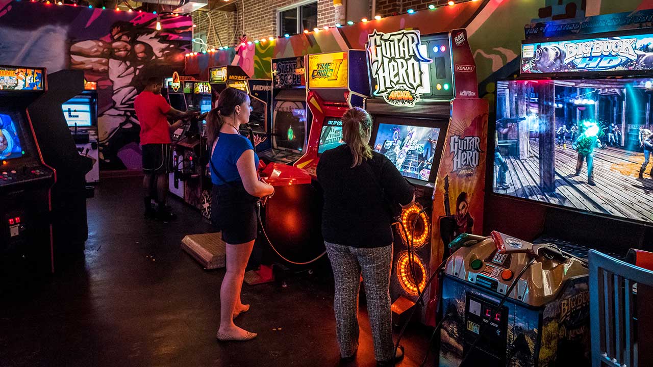 Arcade with people in it at Boxcar Bar