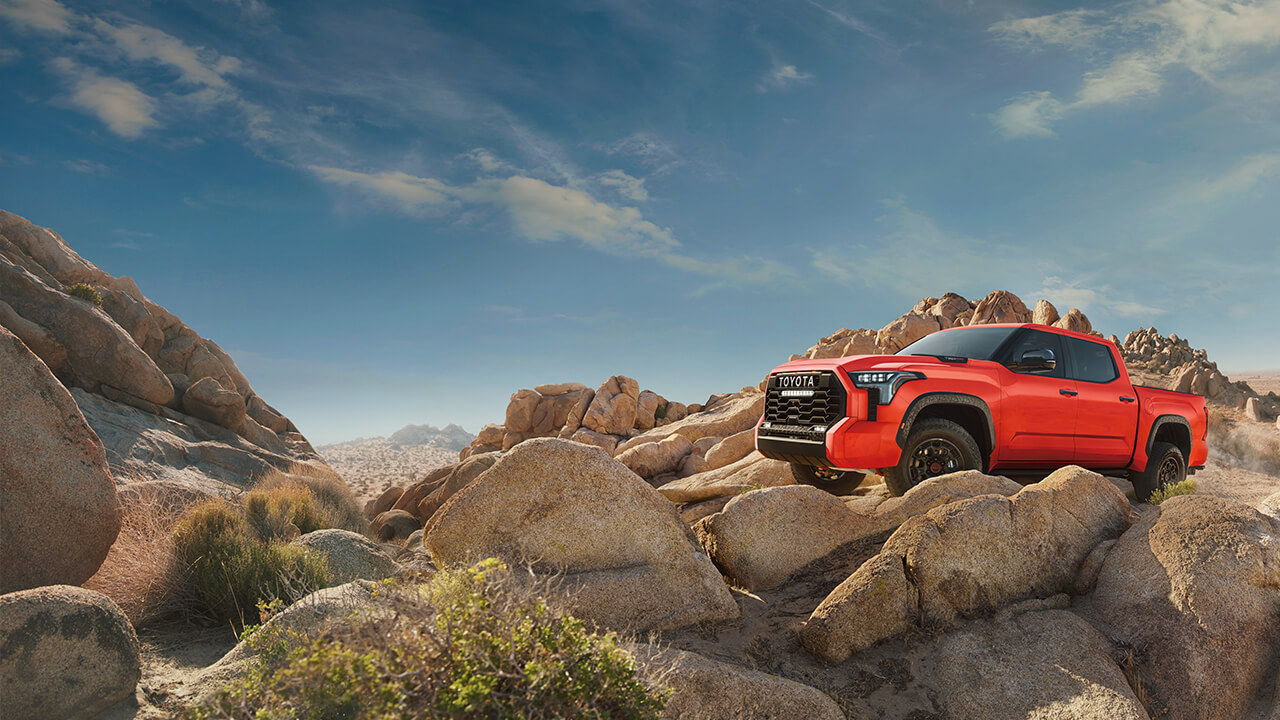 Burnt Orange 2022 Tundra climbing rocks