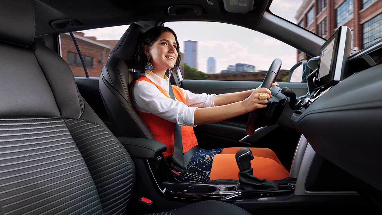 Women in drivers seat of a Corolla