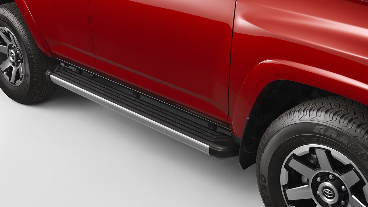 A black running board spans the bottom of a red 4Runner.