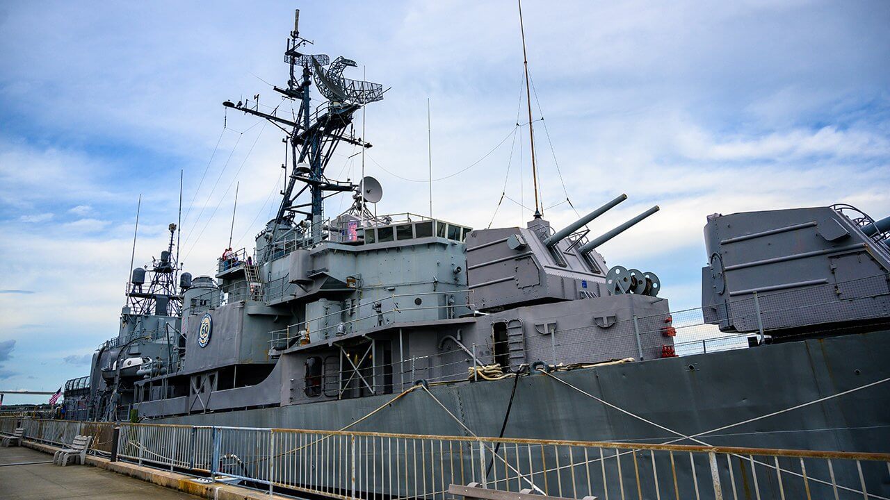 The U.S.S. Laffey floats beside a sidewalk at Patriots Point Naval and Maritime Museum in Mount Pleasant, South Carolina.