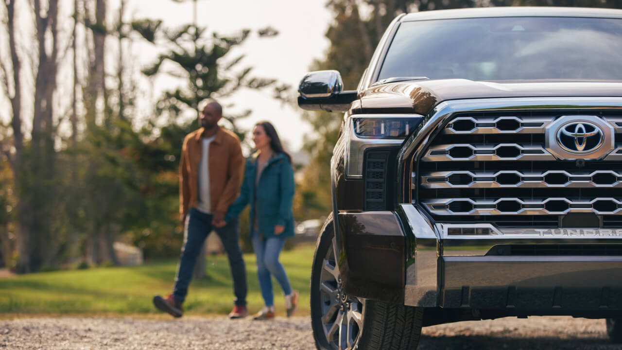 Couple walking behind 2022 Tundra