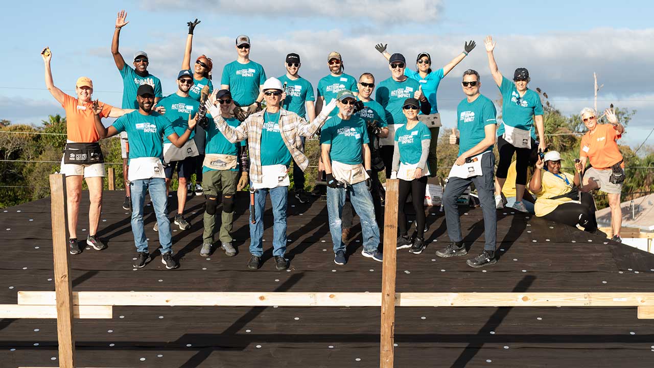 Associates on a roof top for Habitat for Humanity